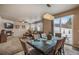 Open concept dining area with view into living room and backyard at 17395 Leisure Lake Dr, Monument, CO 80132