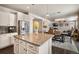 Open concept kitchen with island and granite countertops at 17395 Leisure Lake Dr, Monument, CO 80132