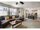 Living room with fireplace, comfy sectional sofa and large windows at 17395 Leisure Lake Dr, Monument, CO 80132