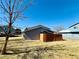 The exterior features blue siding, complemented by a rich, wooden fence for a welcoming yard aesthetic at 1049 W 112Th Ave # A, Denver, CO 80234