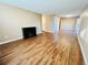 Bright and open living room with wood floors and a charming electric fireplace at 1049 W 112Th Ave # A, Denver, CO 80234