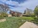 Spacious backyard featuring a large deck, mature trees, and plenty of room for outdoor activities at 1488 W 102Nd Ave, Northglenn, CO 80260