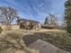 Expansive backyard with a wooden deck, mature trees, and plenty of space for outdoor activities at 1488 W 102Nd Ave, Northglenn, CO 80260