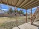 Spacious backyard with a covered patio and mature trees at 1488 W 102Nd Ave, Northglenn, CO 80260