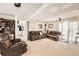 Spacious basement with multiple seating arrangements and natural light from sliding doors at 1488 W 102Nd Ave, Northglenn, CO 80260