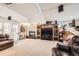 Large basement recreation room includes a fireplace, large TV, and comfortable seating at 1488 W 102Nd Ave, Northglenn, CO 80260