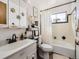 Bright bathroom with a tub and shower, classic fixtures, and ample storage space at 1488 W 102Nd Ave, Northglenn, CO 80260