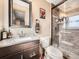 Cozy bathroom featuring a glass-enclosed shower, modern fixtures, and neutral tones at 1488 W 102Nd Ave, Northglenn, CO 80260