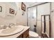 Bright bathroom with updated vanity and a walk-in shower with framed glass doors at 1488 W 102Nd Ave, Northglenn, CO 80260
