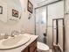 Clean bathroom featuring single sink vanity, tile counters and glass enclosed shower at 1488 W 102Nd Ave, Northglenn, CO 80260