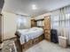 Cozy bedroom with built in headboard and storage and warm lighting at 1488 W 102Nd Ave, Northglenn, CO 80260
