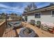 Relaxing deck featuring a gas fire pit, wicker furniture, and gas grill at 1488 W 102Nd Ave, Northglenn, CO 80260