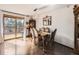 Elegant dining room featuring hardwood floors, a chandelier, and access to an outdoor deck at 1488 W 102Nd Ave, Northglenn, CO 80260