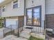Close-up of the home's entrance featuring double doors, brick accents, and well-kept walkway at 1488 W 102Nd Ave, Northglenn, CO 80260