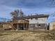 Back exterior view featuring a large back yard and a two level wood deck at 1488 W 102Nd Ave, Northglenn, CO 80260