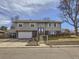 Charming two-story home with light gray siding, attached garage, and well-maintained front yard at 1488 W 102Nd Ave, Northglenn, CO 80260