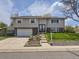 Charming two-story home featuring a well-maintained front yard, garage and inviting entrance at 1488 W 102Nd Ave, Northglenn, CO 80260
