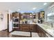 Modern kitchen with stainless steel appliances, custom cabinetry, and stylish countertops at 1488 W 102Nd Ave, Northglenn, CO 80260