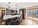 Spacious kitchen with quartz countertop island, stainless appliances, and access to the deck at 1488 W 102Nd Ave, Northglenn, CO 80260
