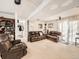 Large basement living room featuring carpet floors, comfortable couches, and natural light at 1488 W 102Nd Ave, Northglenn, CO 80260