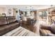Open floor plan showcasing the living room and kitchen, with hardwood floors and a large island at 1488 W 102Nd Ave, Northglenn, CO 80260