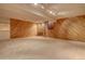 Finished basement with wood paneled walls at 112 S Holman Way, Golden, CO 80401