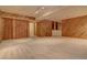 Finished basement with wood paneled walls and storage at 112 S Holman Way, Golden, CO 80401