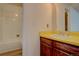 Bright bathroom with yellow vanity and bathtub at 112 S Holman Way, Golden, CO 80401