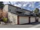 Townhouse exterior with two-car garage and balcony at 112 S Holman Way, Golden, CO 80401