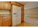 White appliances and wood cabinets in kitchen at 112 S Holman Way, Golden, CO 80401