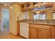 Bright kitchen features double sink, dishwasher, and ample cabinetry at 112 S Holman Way, Golden, CO 80401