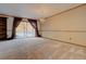 Spacious living room with carpeting, large window, and chandelier at 112 S Holman Way, Golden, CO 80401