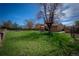 Large grassy backyard offering ample space for recreation and outdoor activities at 1562 Madison Ct, Louisville, CO 80027