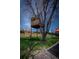 Expansive backyard featuring a unique treehouse, perfect for outdoor play and relaxation at 1562 Madison Ct, Louisville, CO 80027