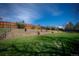 Multi-tiered backyard with landscaped retaining walls and lush greenery, creating a serene outdoor space at 1562 Madison Ct, Louisville, CO 80027