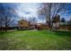 Large backyard with mature tree and custom treehouse, plus a patio and grill for easy entertaining at 1562 Madison Ct, Louisville, CO 80027