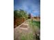 Established garden beds and fenced perimeter in the backyard, perfect for gardening enthusiasts at 1562 Madison Ct, Louisville, CO 80027