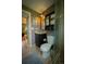 Compact bathroom showcasing a vanity, toilet, and glass-enclosed shower at 1562 Madison Ct, Louisville, CO 80027