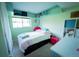 Well-lit bedroom with a single bed, storage space, and a cozy atmosphere at 1562 Madison Ct, Louisville, CO 80027