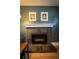 Close-up view of the fireplace with slate tile surround and decorative mantel at 1562 Madison Ct, Louisville, CO 80027
