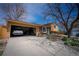 Charming home with attached garage and well-maintained landscaping, offering curb appeal and convenience at 1562 Madison Ct, Louisville, CO 80027