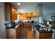Modern kitchen features stainless steel appliances, granite countertops, and ample cabinet space at 1562 Madison Ct, Louisville, CO 80027