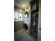 Efficient laundry room with stacked washer and dryer, providing convenient space-saving solution at 1562 Madison Ct, Louisville, CO 80027