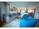 Open living room with hardwood floors, neutral walls, and view to kitchen and dining room at 1562 Madison Ct, Louisville, CO 80027