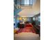 Comfortable living room with fireplace, plush seating, and stairway access at 1562 Madison Ct, Louisville, CO 80027