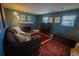 Inviting living room featuring a fireplace, comfy sofa, and natural light from the windows at 1562 Madison Ct, Louisville, CO 80027