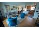 Open living room with hardwood floors, neutral walls, and view to kitchen and dining room at 1562 Madison Ct, Louisville, CO 80027