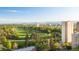A full aerial view of a building next to a beautiful park with trees and a mountain range in the distance at 1201 N Williams St # 3A, Denver, CO 80218