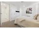 Cozy bedroom featuring neutral tones, soft carpet, and a comfortable queen size bed at 1201 N Williams St # 3A, Denver, CO 80218