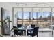 Elegant dining area with large windows offering panoramic views and stylish decor at 1201 N Williams St # 3A, Denver, CO 80218